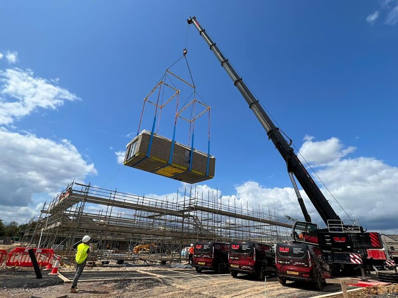 Modular Buildings lifted using a Spreader beam over spreader frames configuration